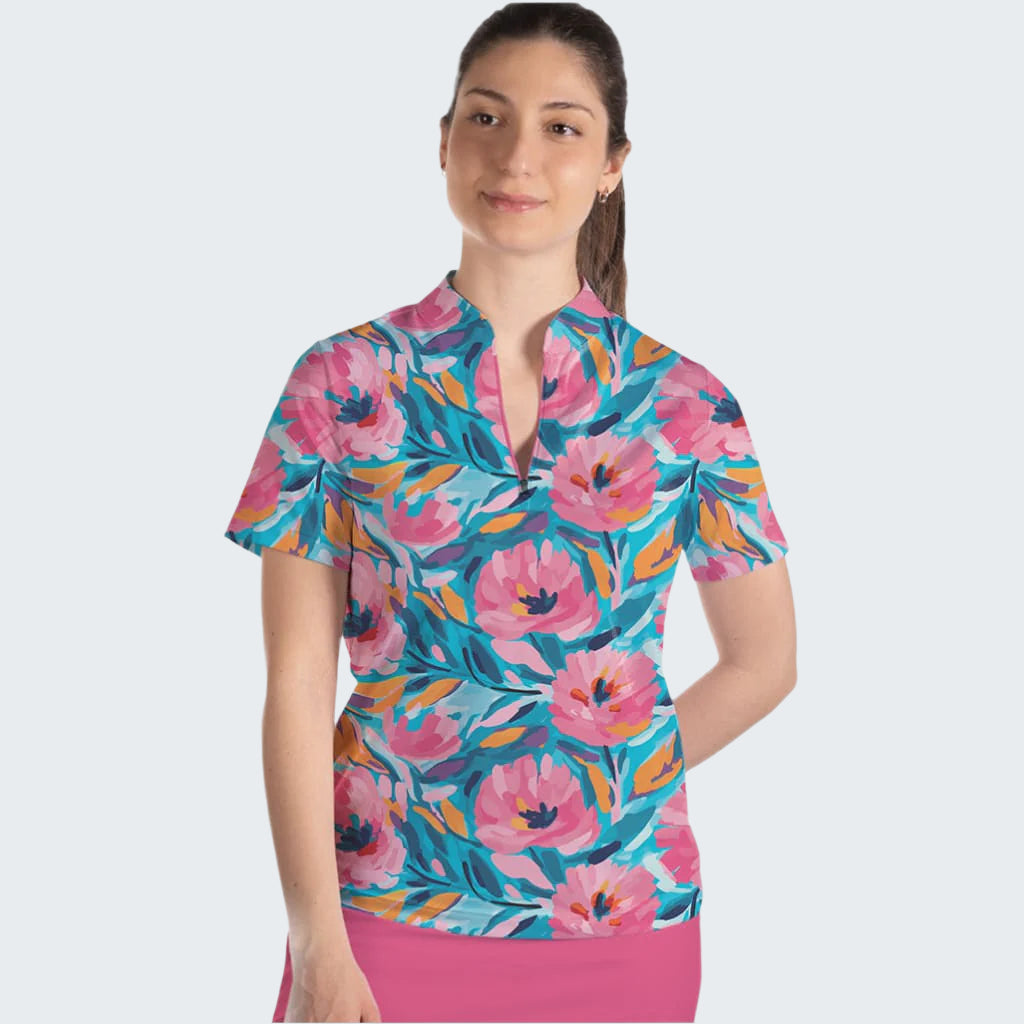 Woman wearing a colorful floral patterned shirt on a white background