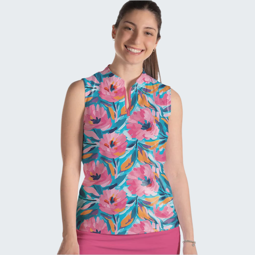 Woman wearing a colorful floral sleeveless top on a white background