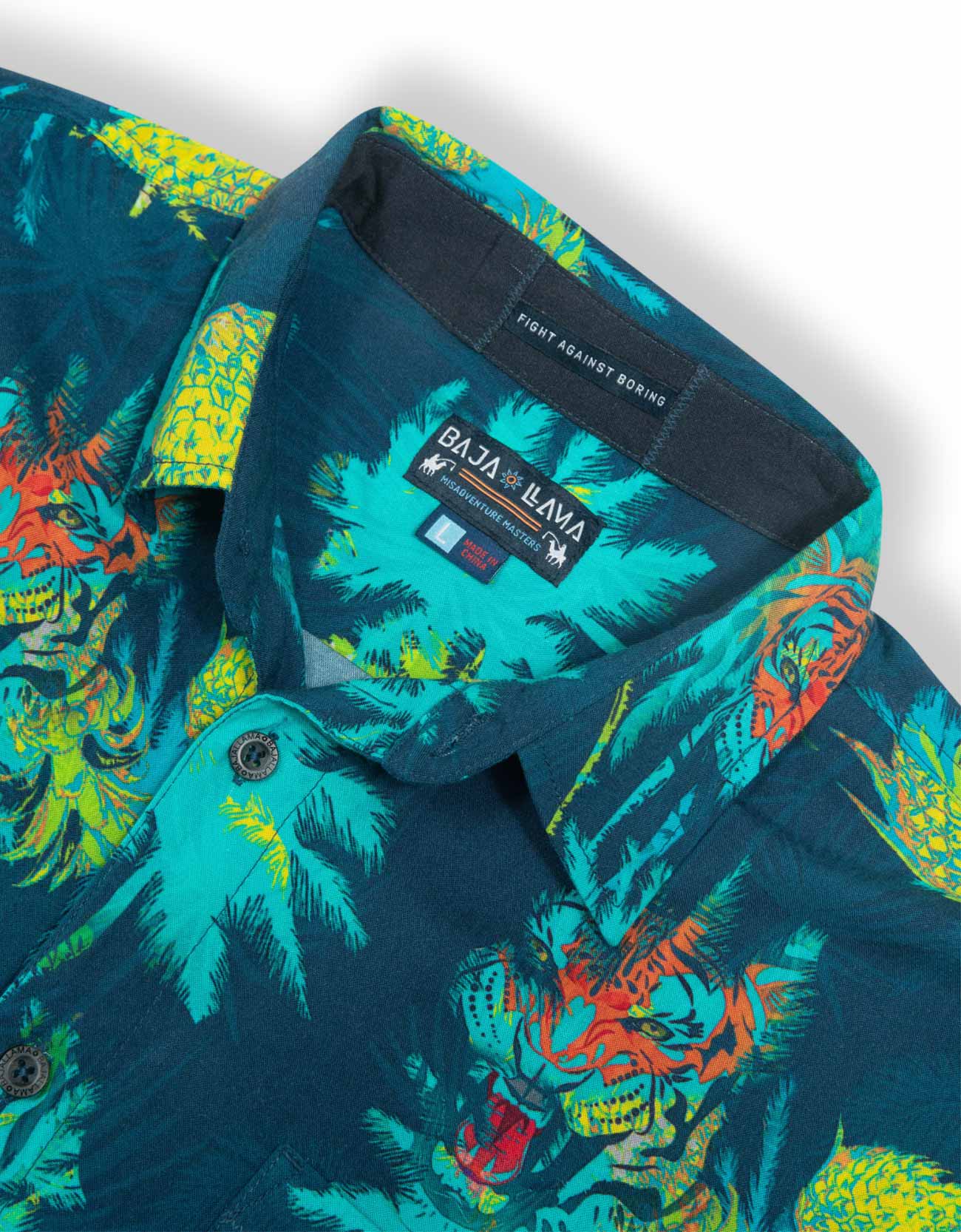 Colorful tropical patterned shirt with brand label on a white background