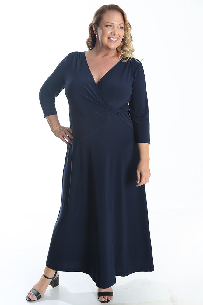 Woman wearing a navy blue dress on a white background