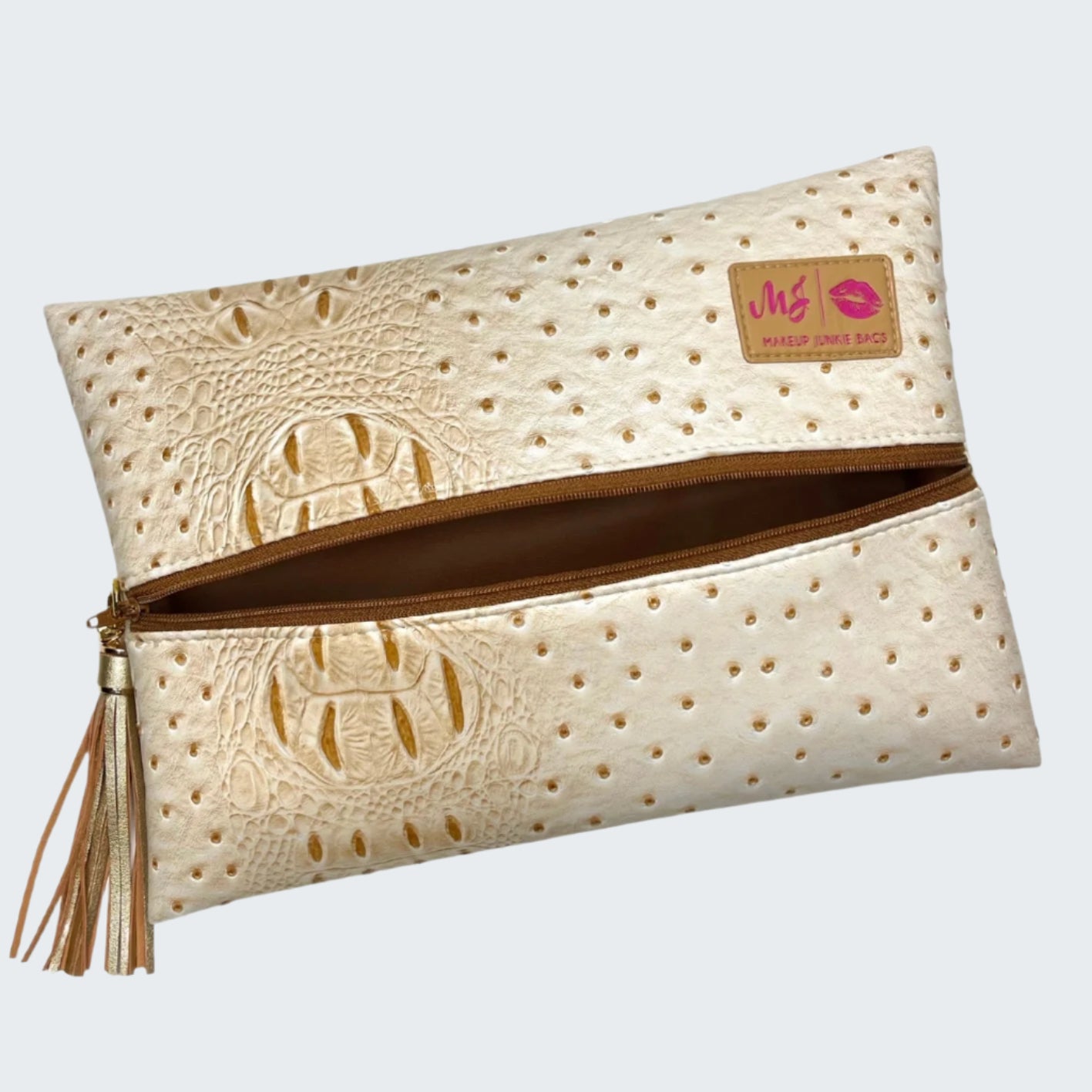 Beige clutch bag with embossed design and visible brand logo on a white background