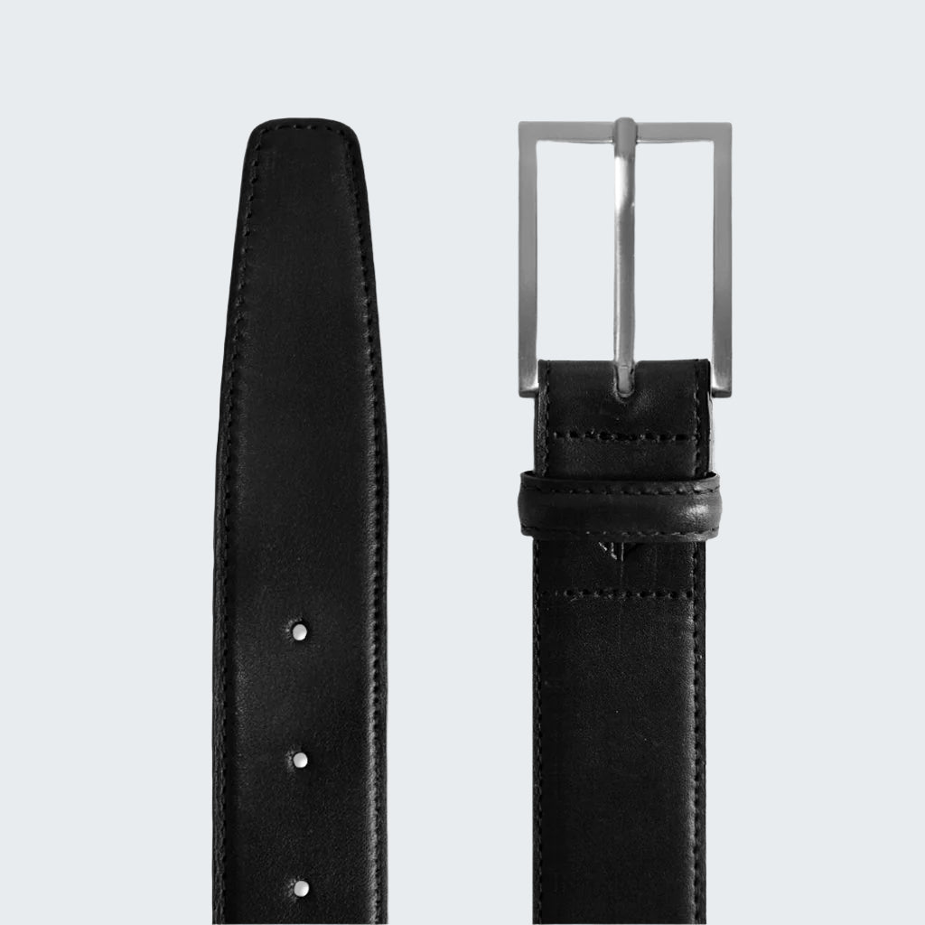 Black leather belt with a silver buckle on a white background