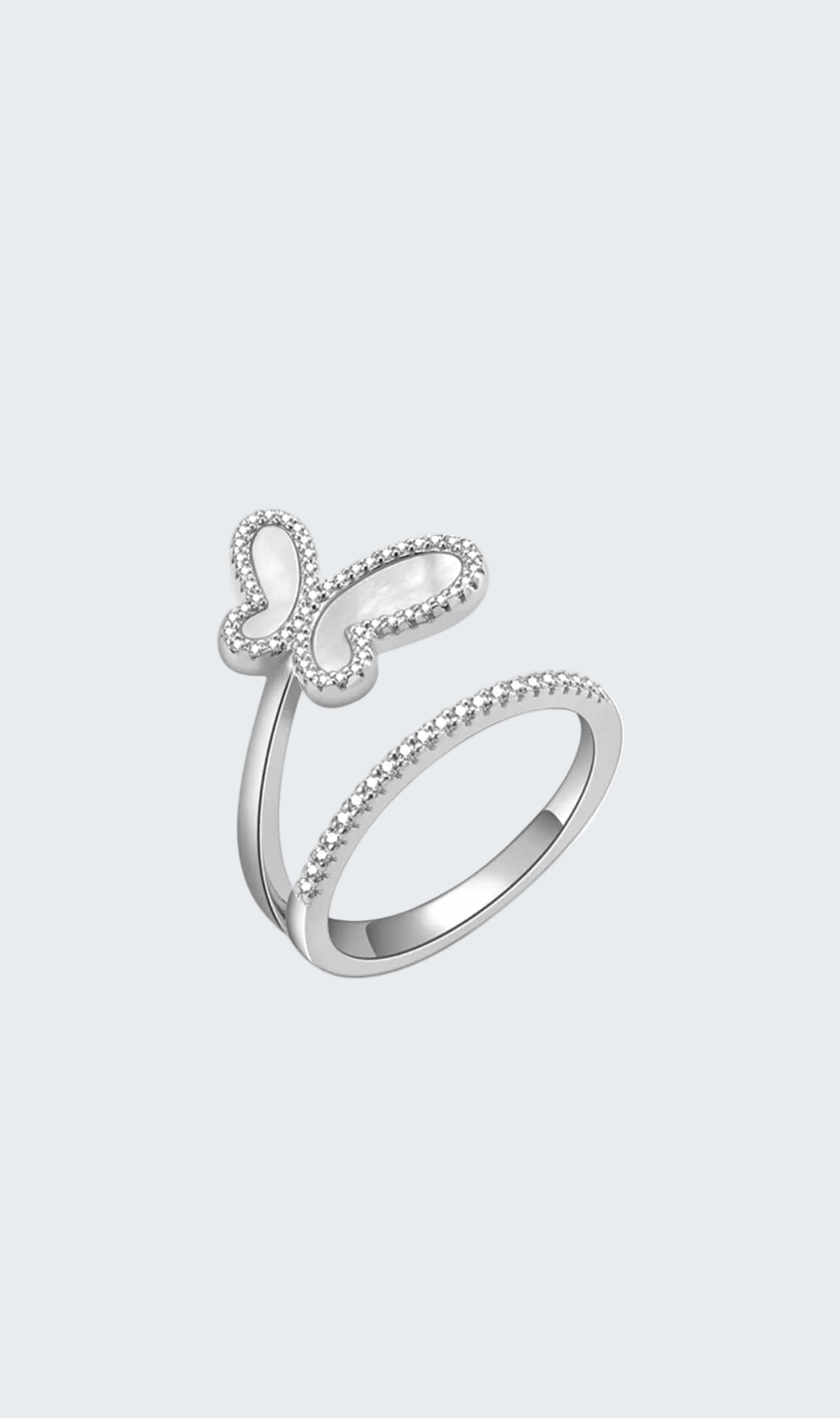 Silver ring with butterfly design on a white background