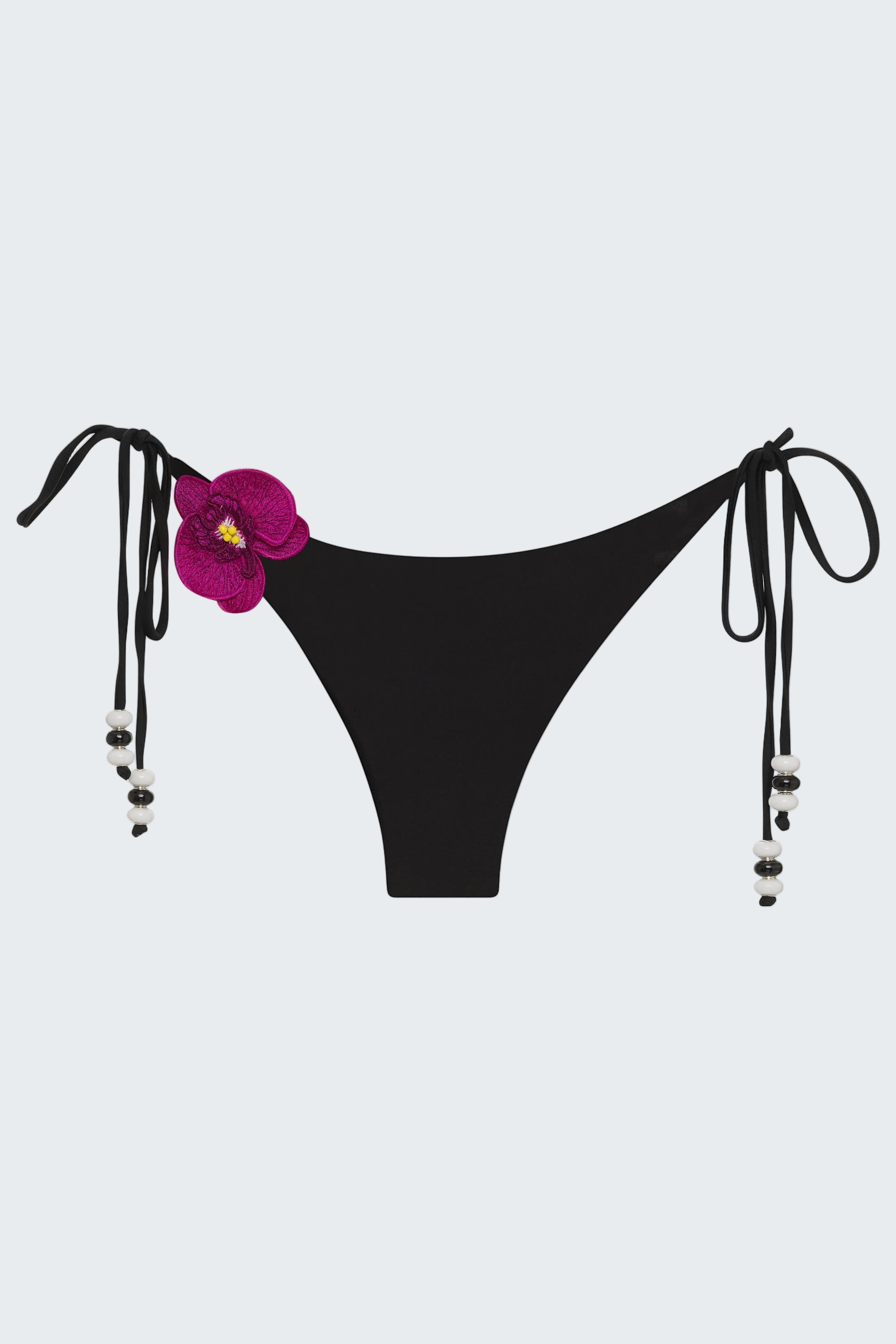 Black bikini bottom with floral design and straps on a white background