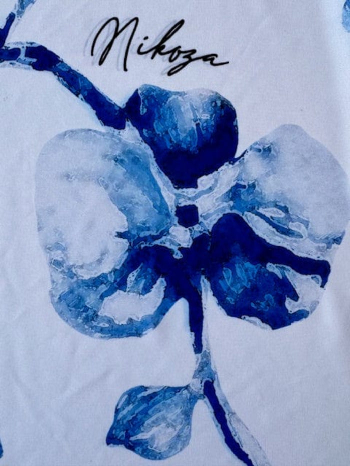 Blue floral design on a white background with 'Nikoza' branding.