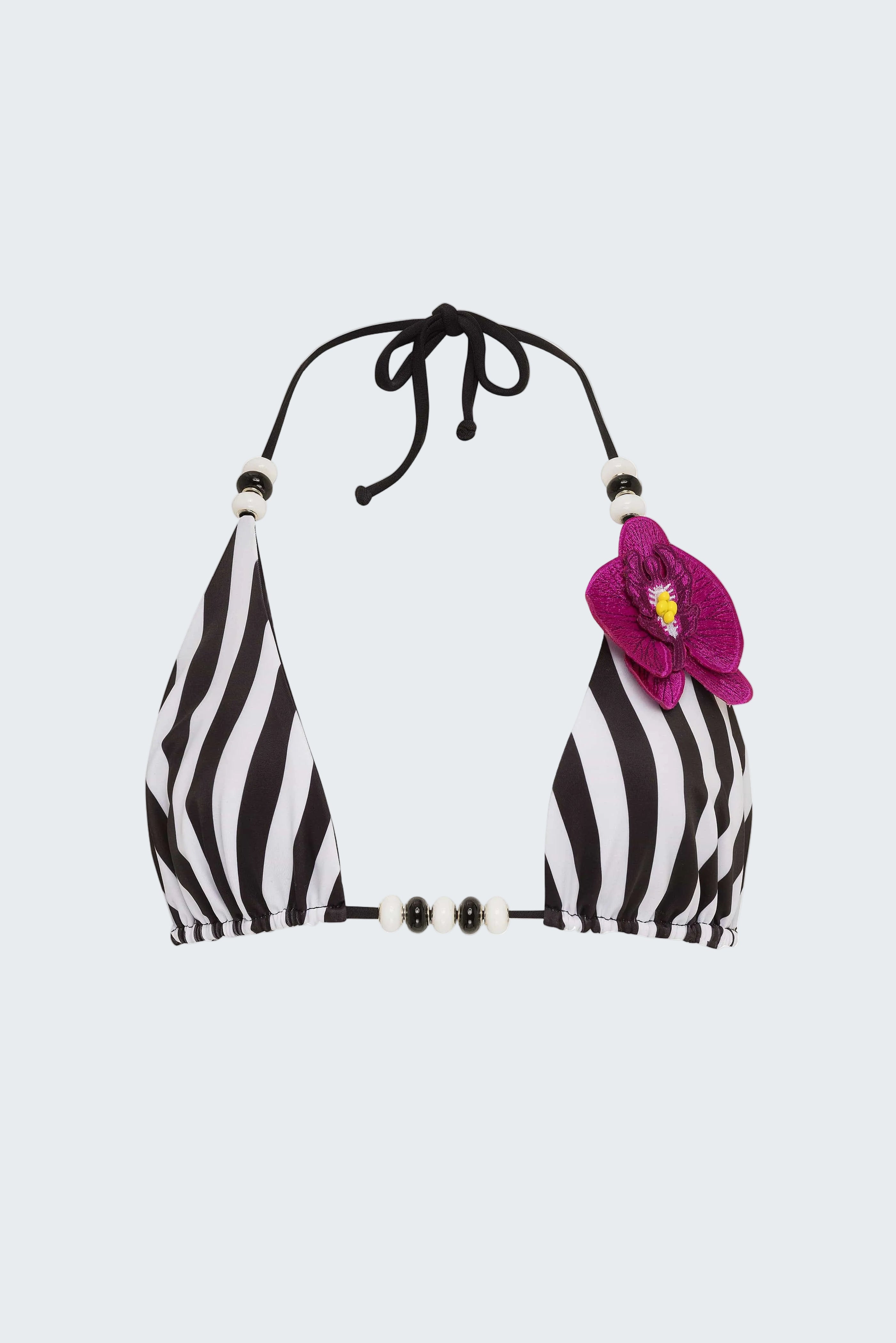 Black and white striped bikini top with a pink flower on a white background