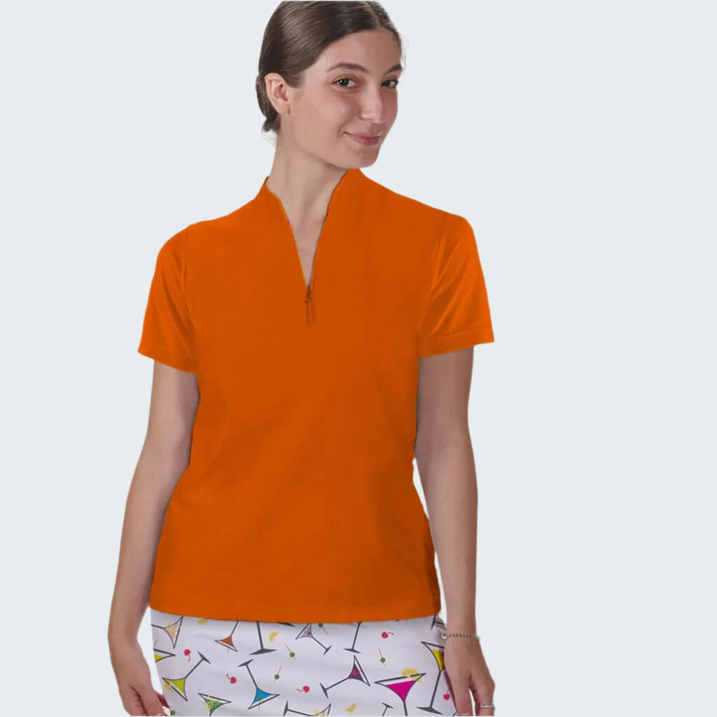 Woman wearing an orange shirt with a white background