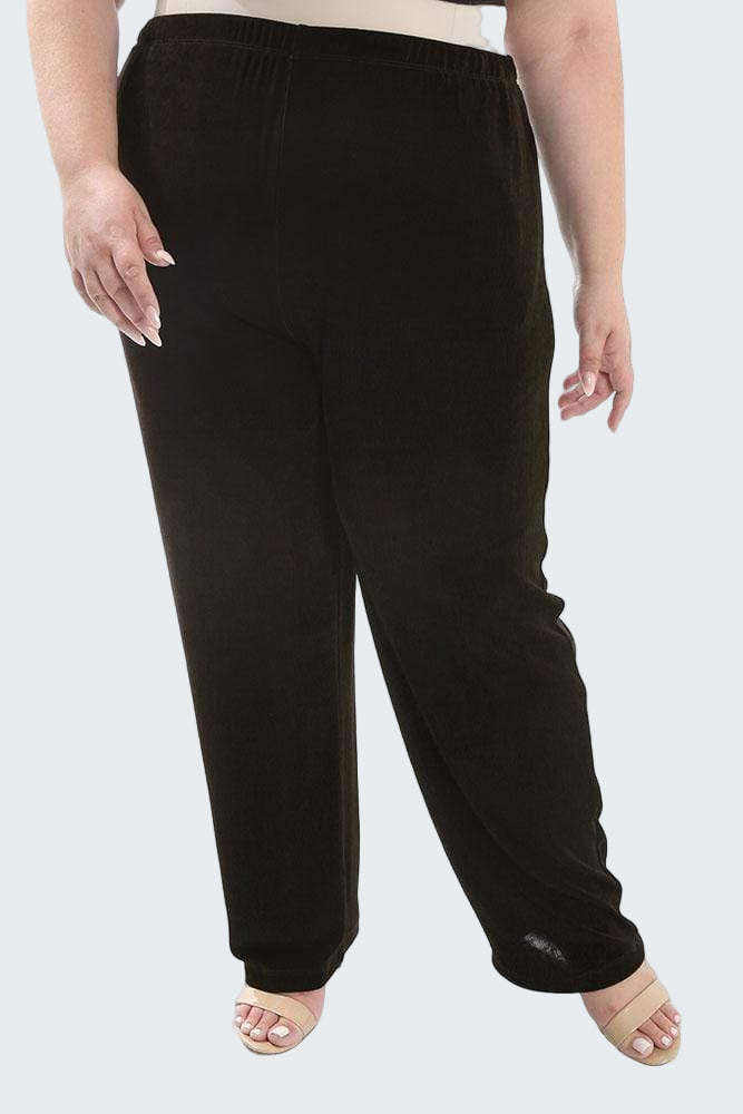 Black pants worn by a person on a white background