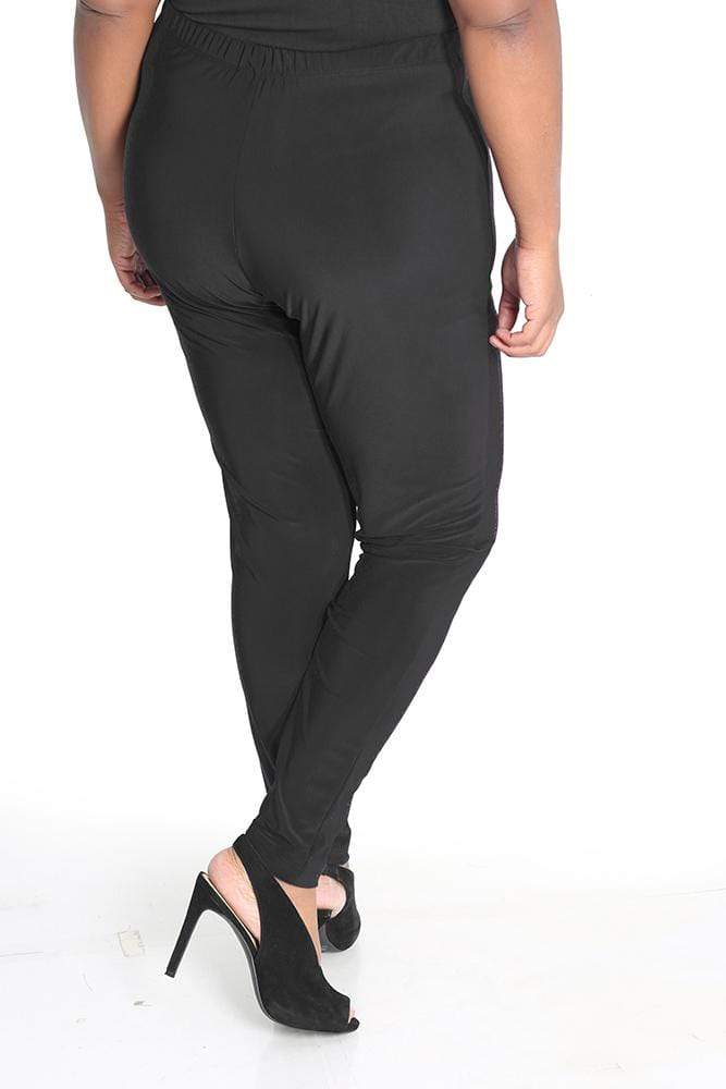 Person wearing black pants on a white background