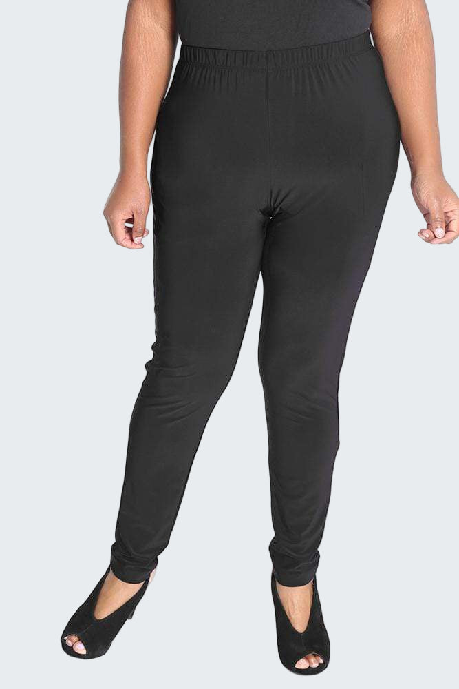 Person wearing black leggings on a white background