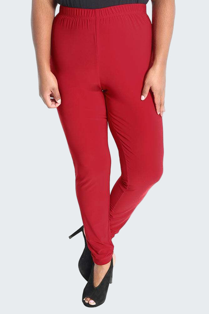 Red pants worn by a person on a white background