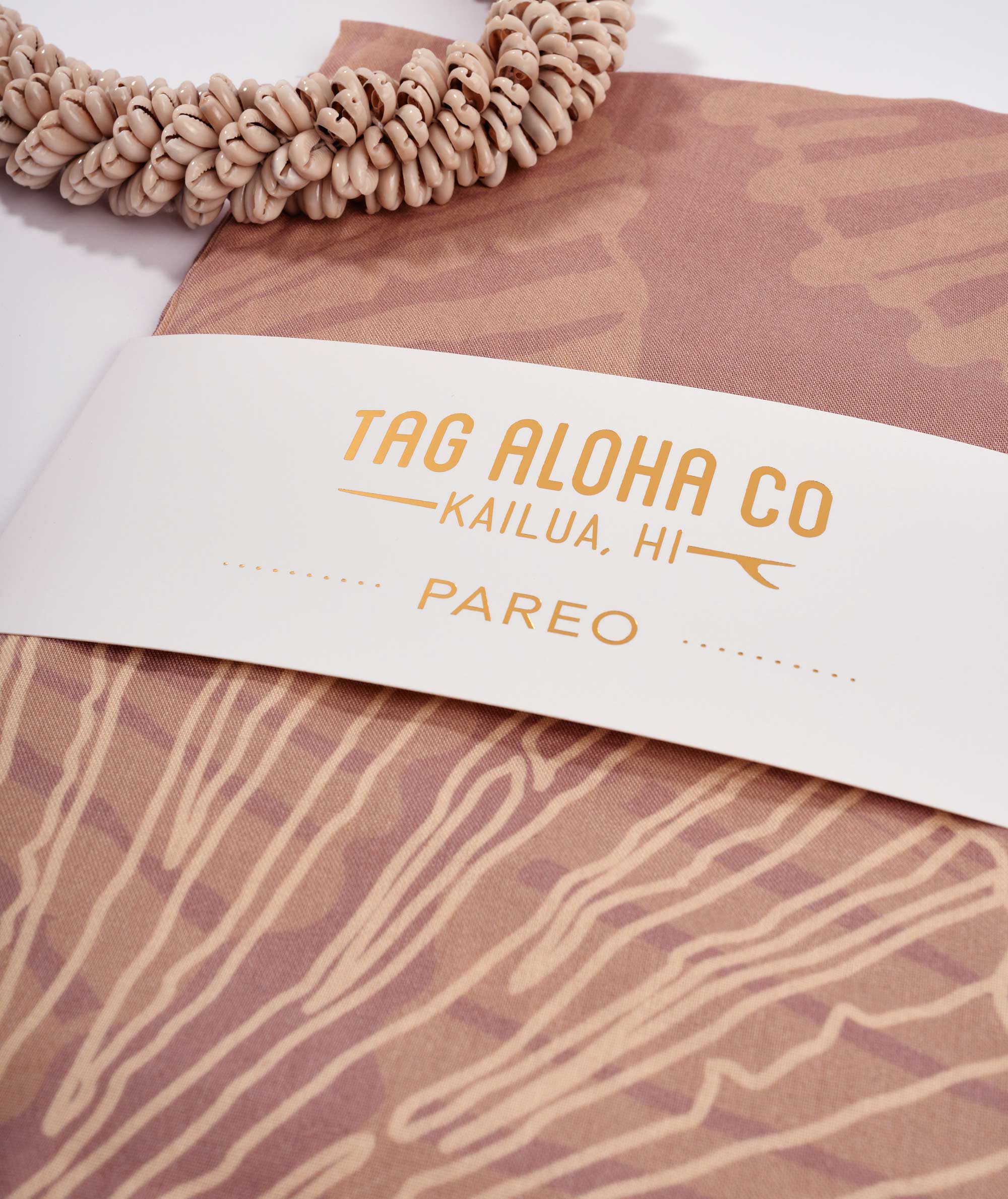 Brown pareo with 'Tag Aloha Co' label on a white background
