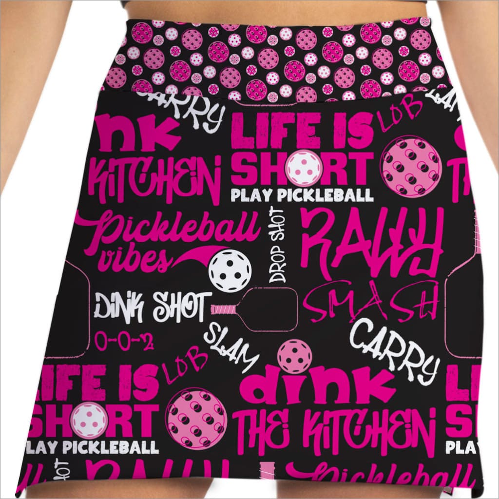 Pickleball-themed skirt with pink and white text and graphics on a black background