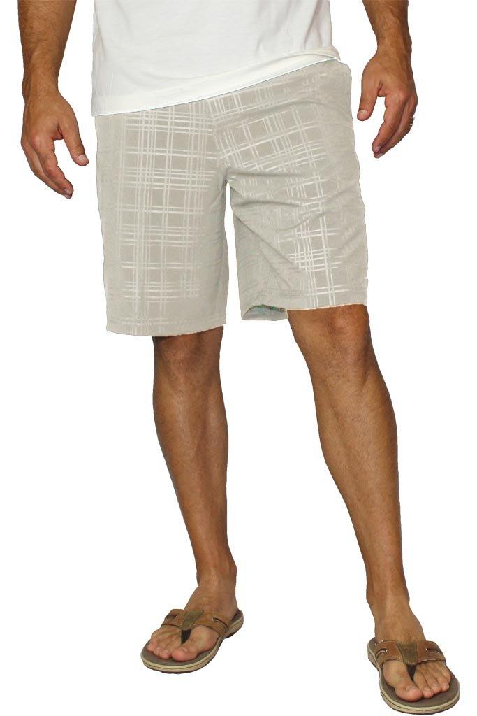 Person wearing light-colored plaid shorts on a white background