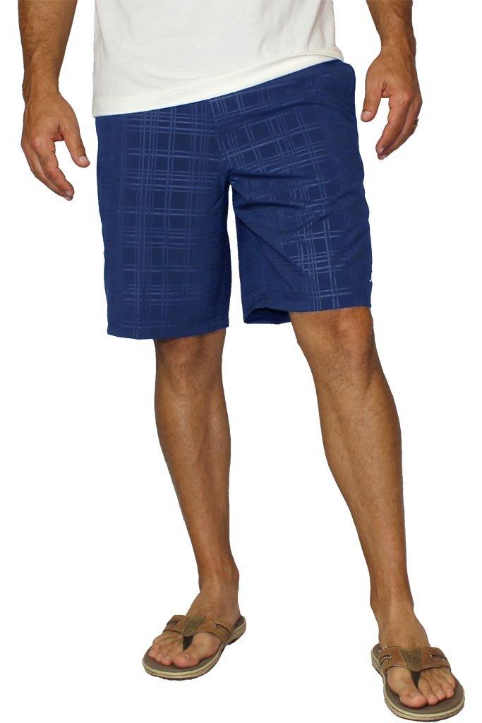Person wearing blue plaid shorts on a white background