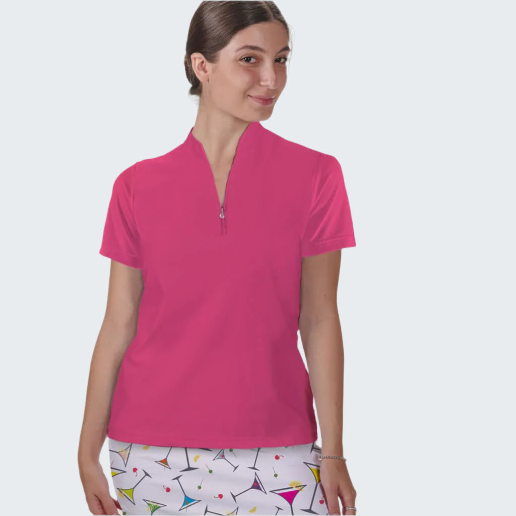 Woman wearing a pink zip-up shirt with a white background