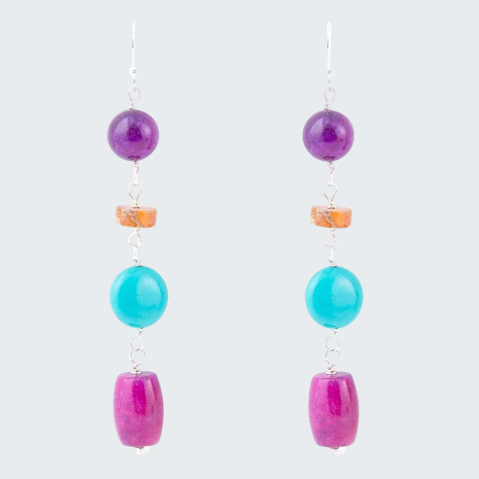 Pair of earrings with colorful beads on a white background