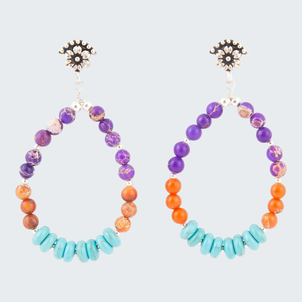 Hoop earrings with colorful beads on a white background