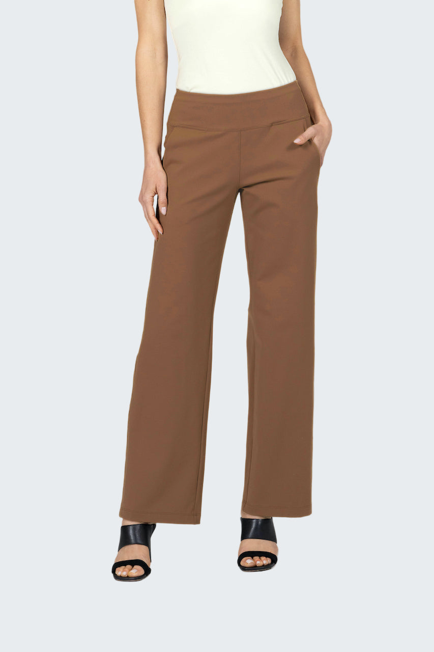 Brown pants worn by a person on a gray background
