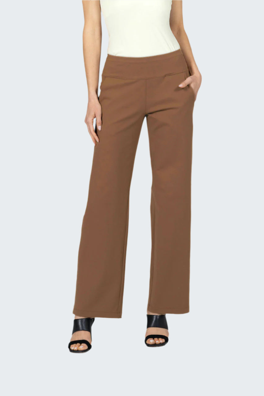 Brown pants worn by a person on a gray background
