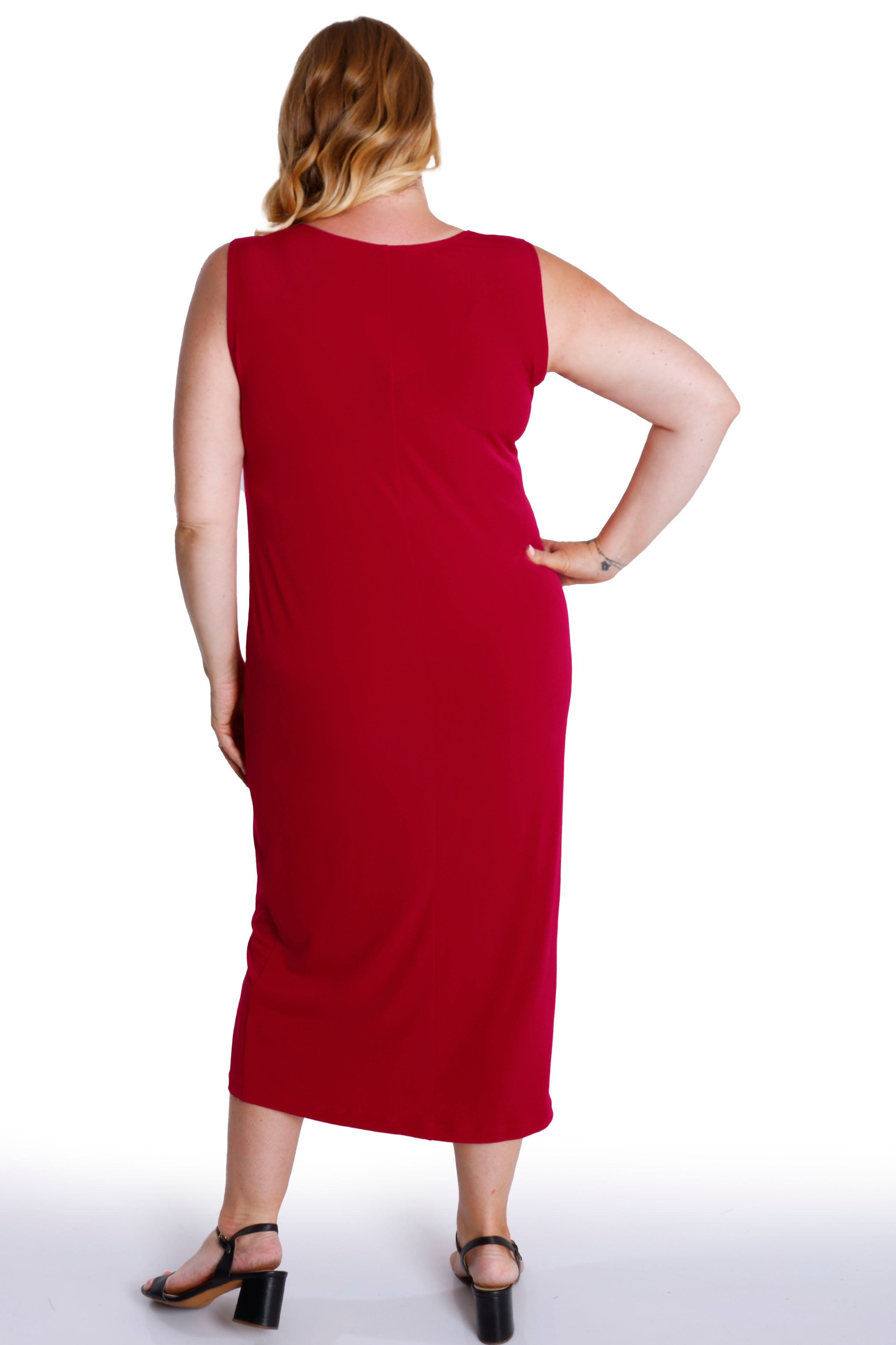 Woman wearing a red sleeveless dress on a white background