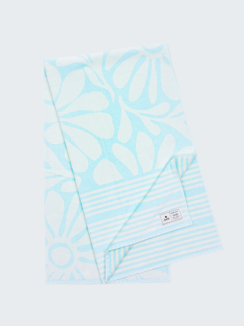 Light blue patterned towel with stripes on a white background