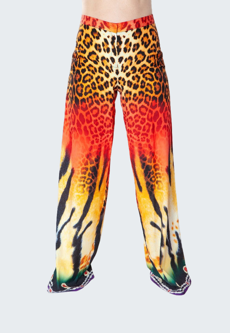 Colorful leopard print pants on a white background