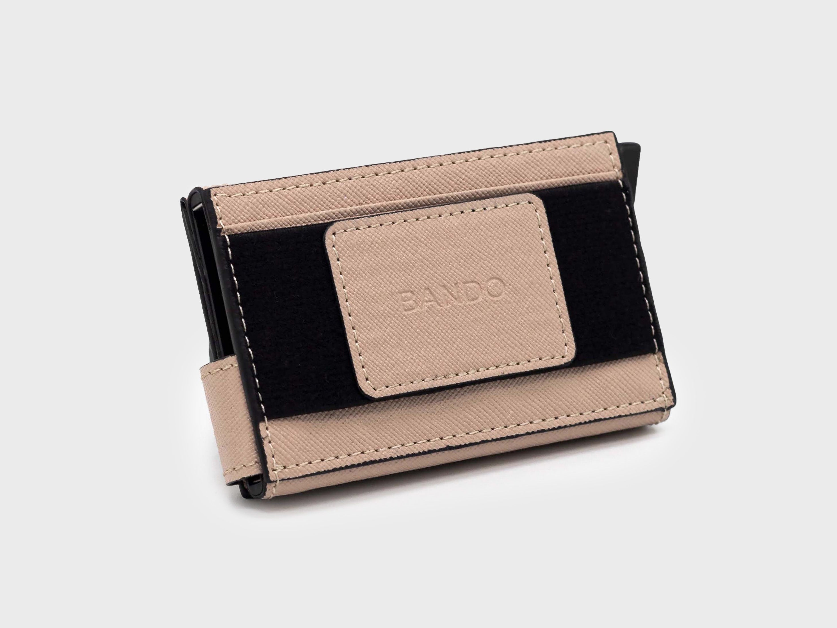 Beige and black wallet with 'Bando' branding on a light gray background