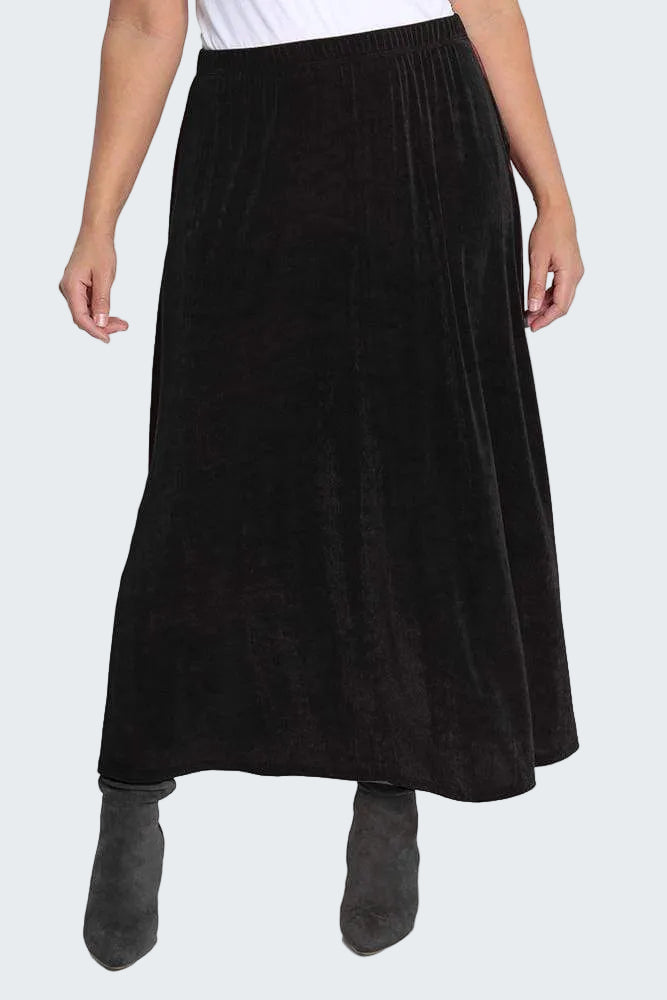 Black skirt worn by a person on a white background