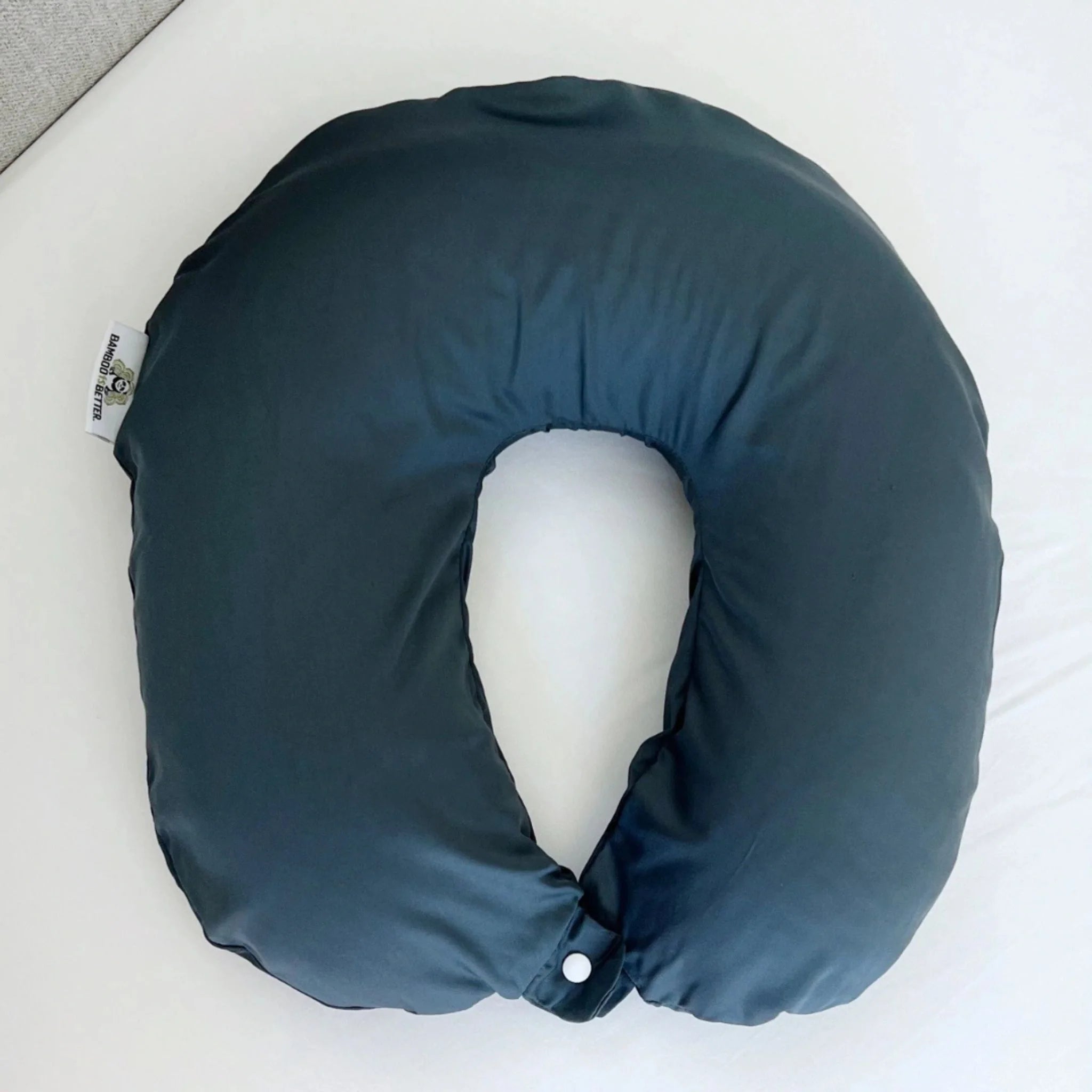 Blue neck pillow on a white surface