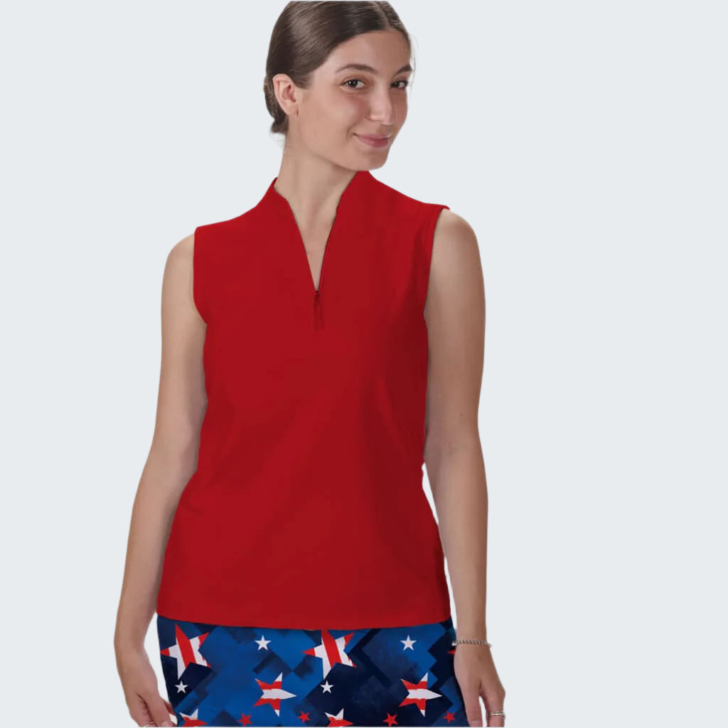 Woman wearing a red sleeveless top and patterned shorts on a white background