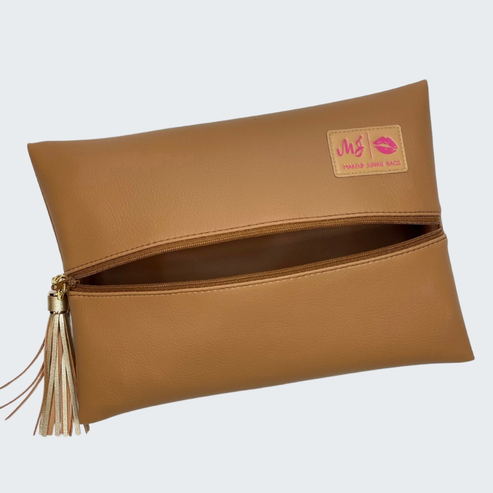 Brown clutch bag with a visible brand label on a white background