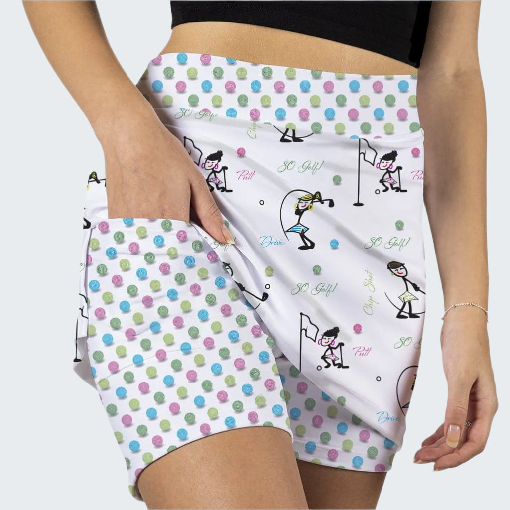 Polka dot shorts with cartoon designs held by a person on a white background