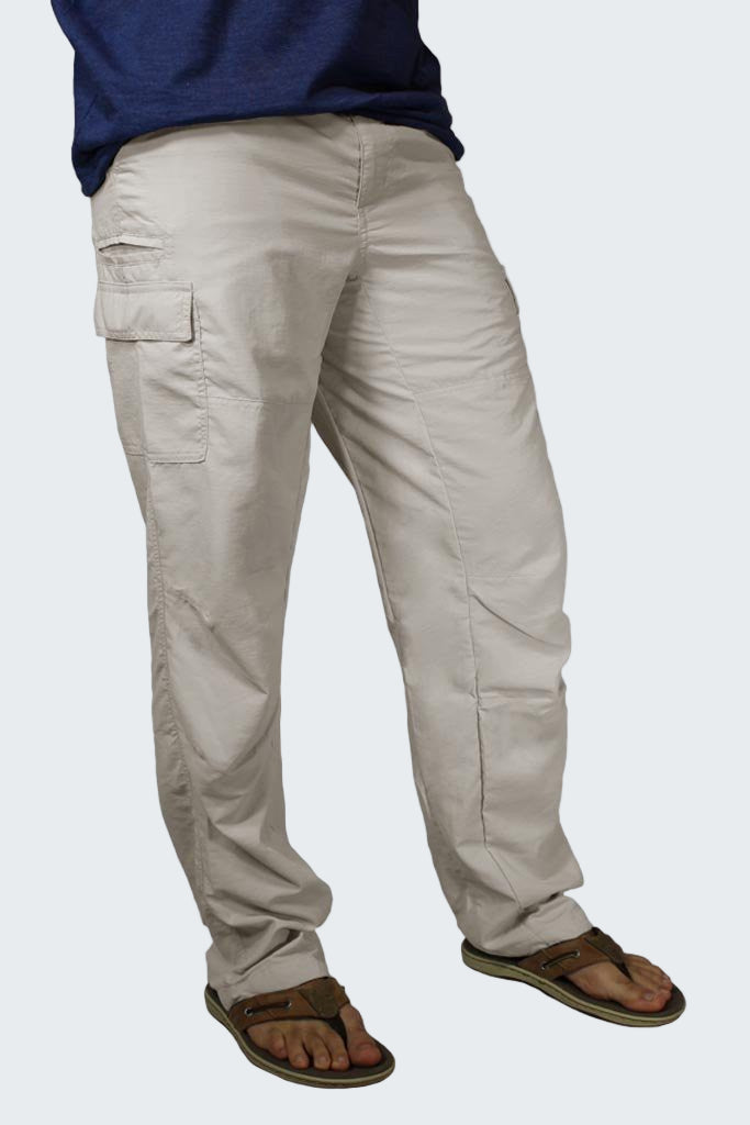 Beige cargo pants worn by a person on a white background