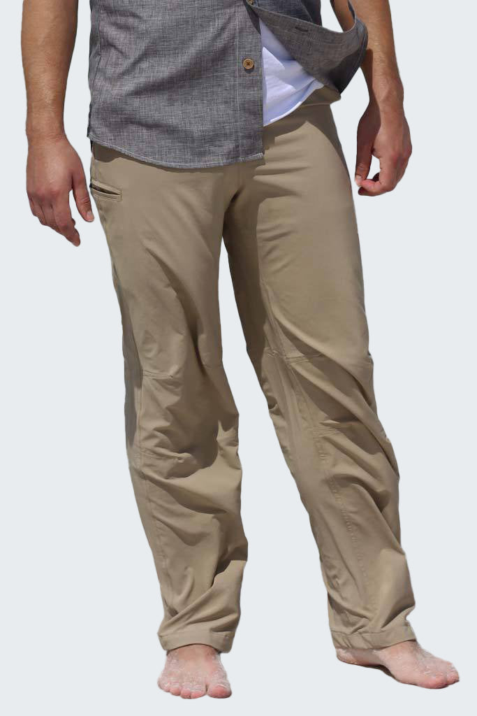 Beige pants worn by a person on a white background
