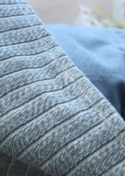 Close-up of textured fabric with a blurred background