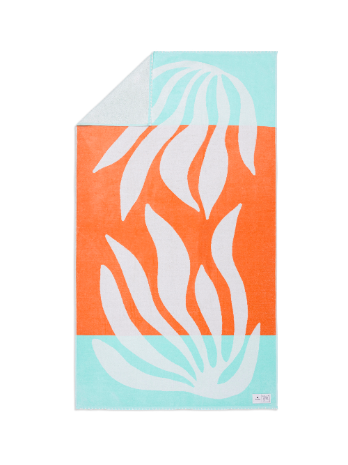 Towel with leaf pattern on orange and light blue background