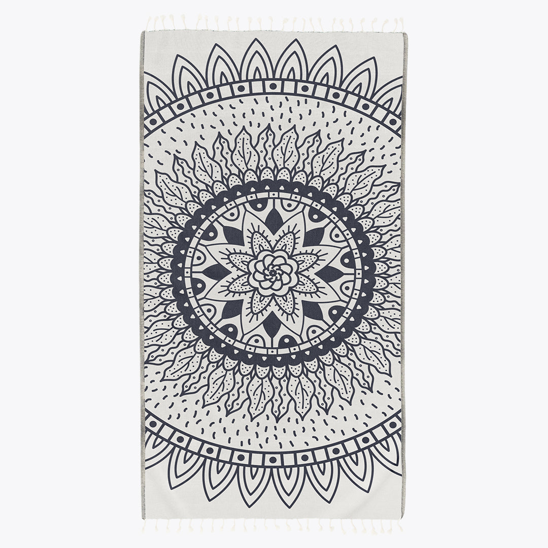 Towel with black mandala design on a white background