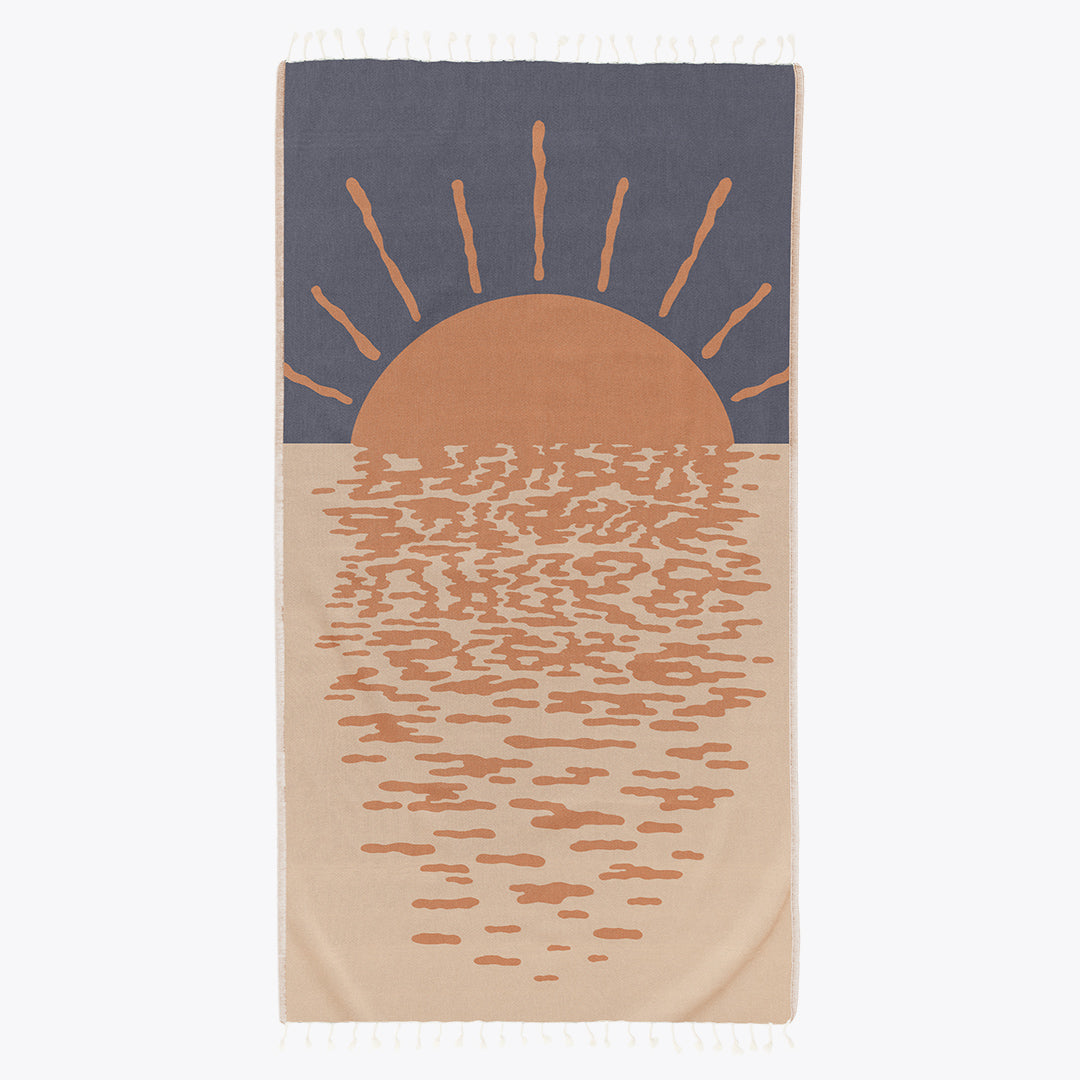 Towel with a sun and water design on a white background