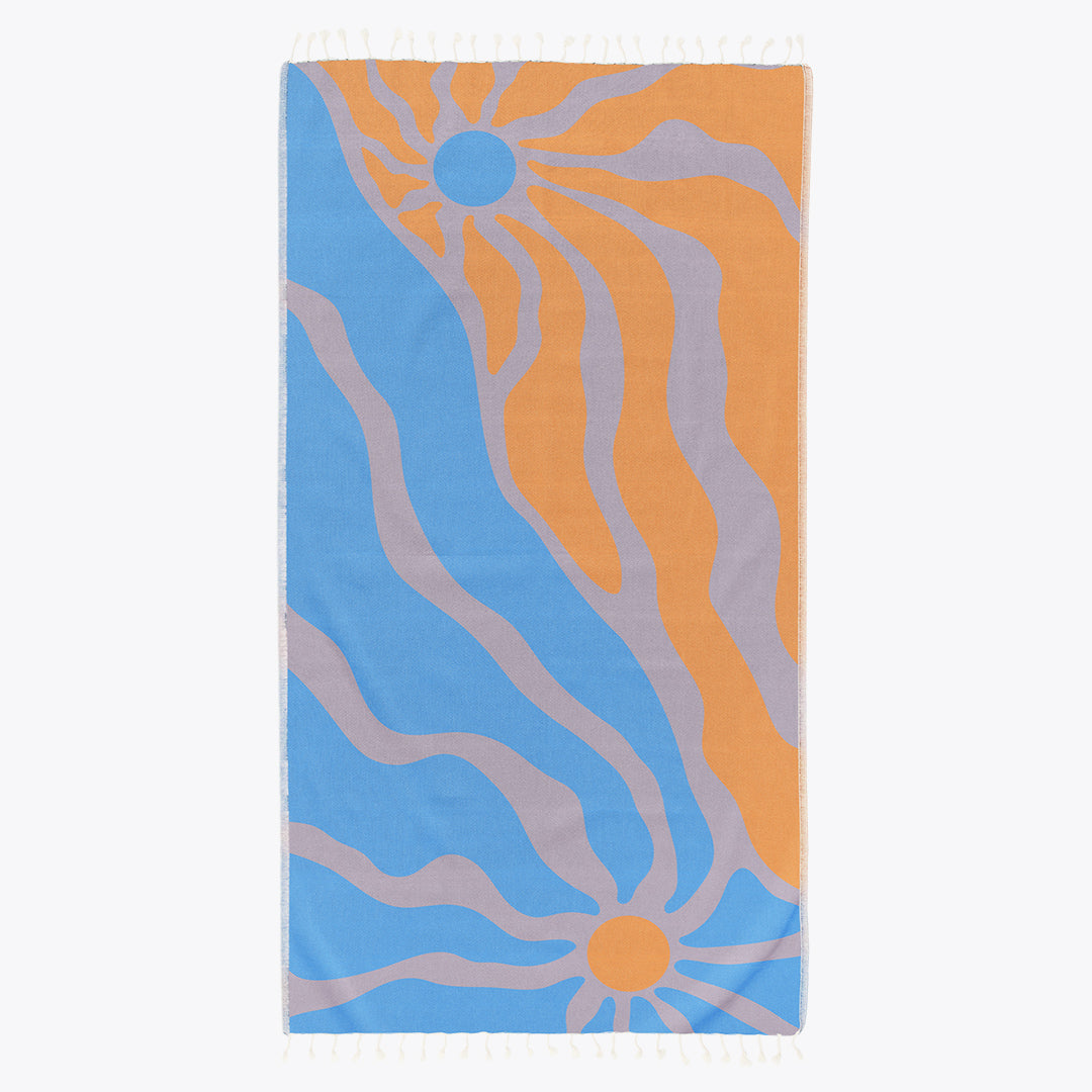 Towel with orange and blue abstract pattern on a white background