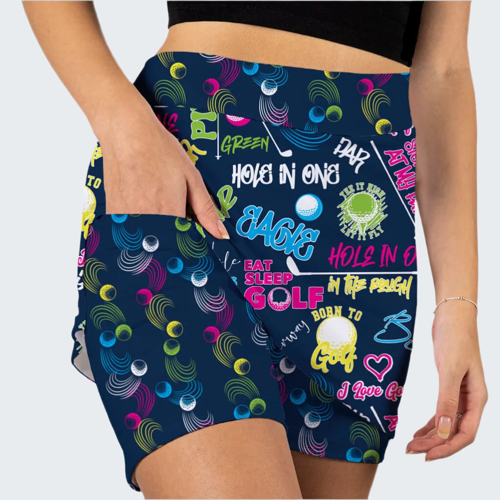 Colorful golf-themed shorts with text and graphics on a navy background