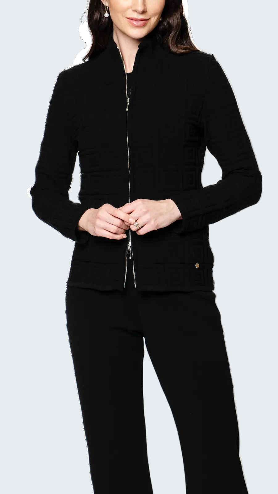 Person wearing a black jacket and pants on a white background