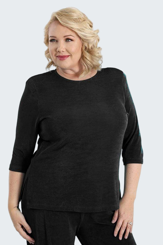 Woman wearing a black outfit on a white background