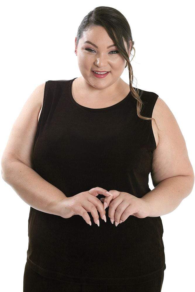 Woman wearing a black sleeveless top on a white background