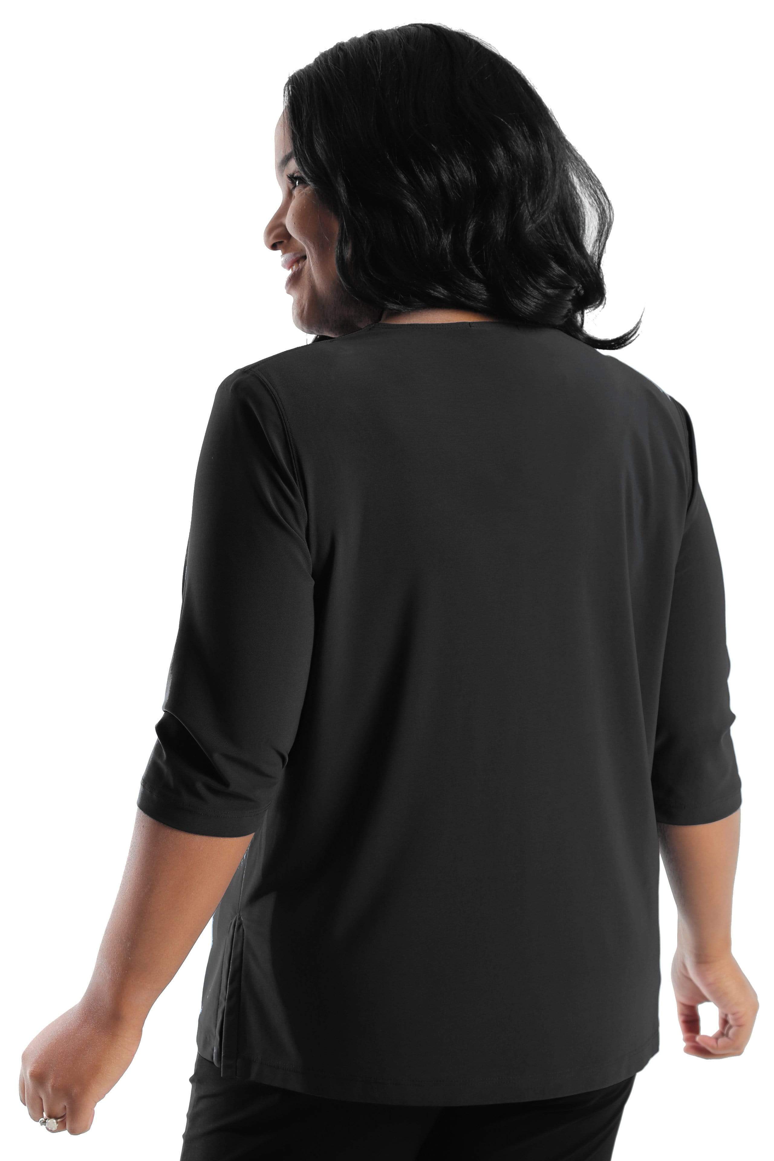 Woman wearing a black long-sleeve top on a white background
