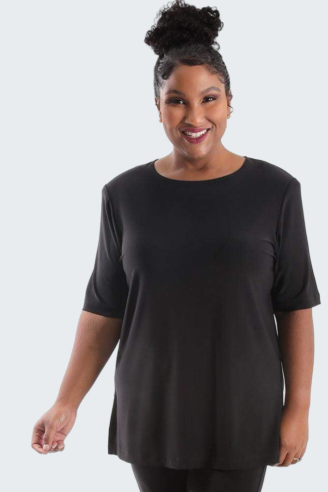 Woman wearing a black tunic with a white background