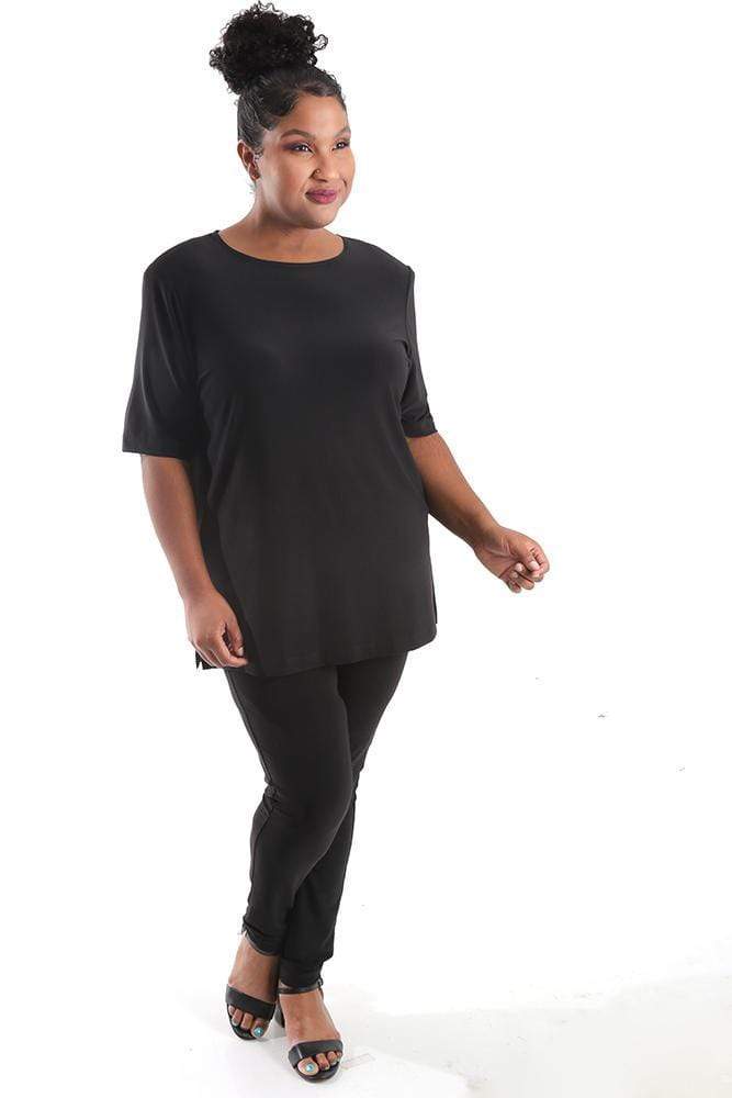 Woman wearing a black outfit on a white background