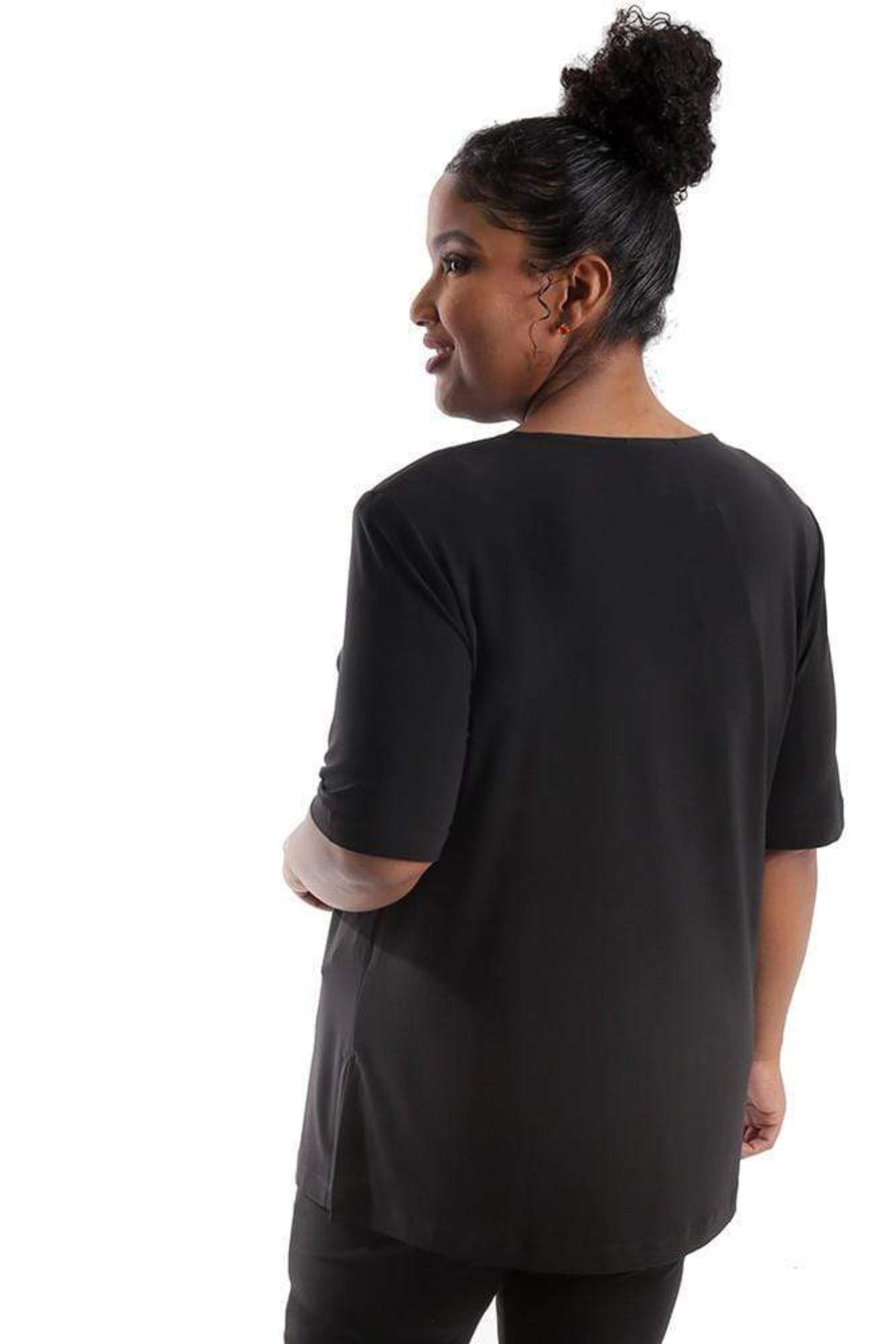 Person wearing a black t-shirt and pants on a white background
