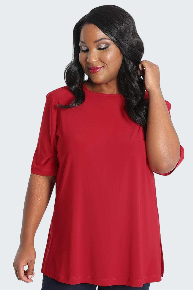 Woman wearing a red top on a white background