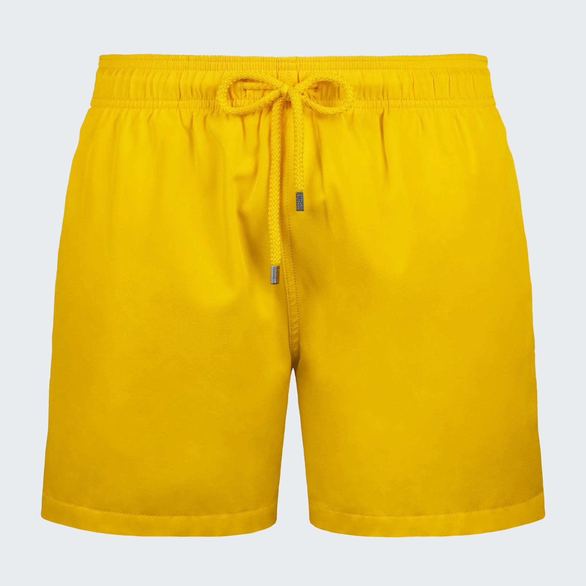 Yellow shorts with a drawstring on a white background